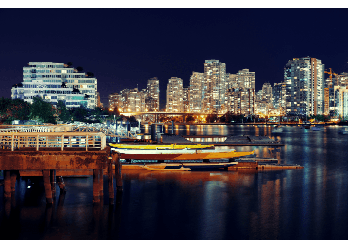 Coastal city lit up at night near the Ocean. Cities never sleep. 