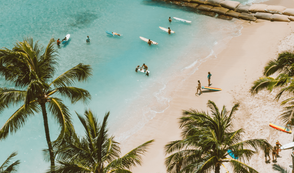 People enjoying a beach and the blue Ocean waves.