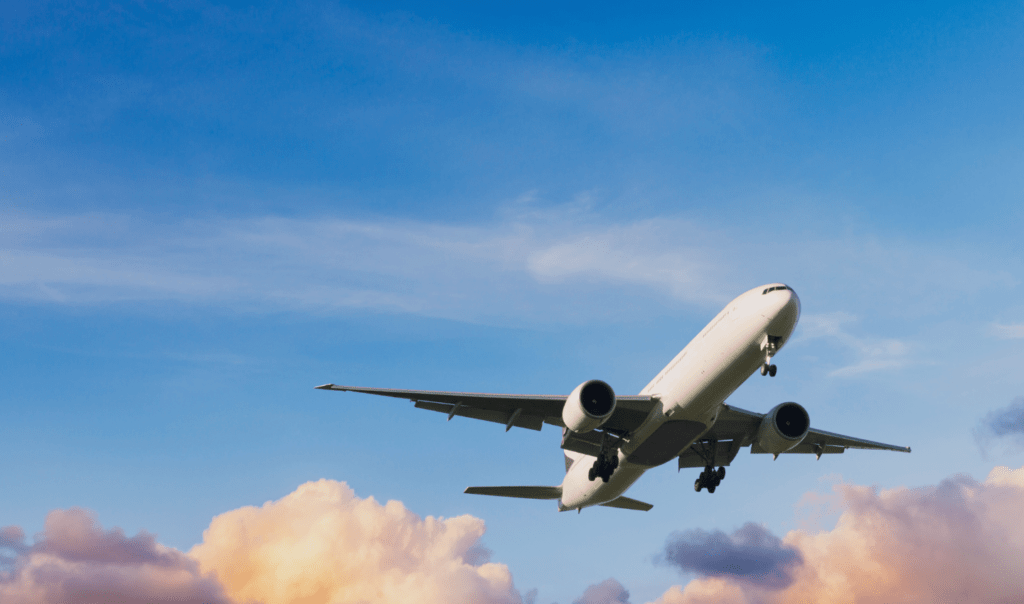 Plane ascending into the sky. Ocean Generation is sharing 7 interesting travel facts linked to the environment in this article.