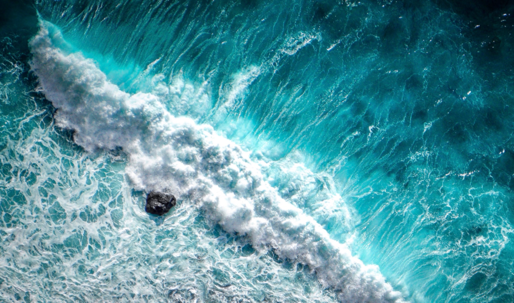 Ocean wave crashing on a rock. Shared by Ocean Generation in an article about why the Ocean is important.