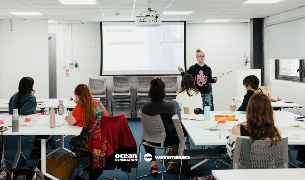 Woman presenting an Ocean education workshop to classroom of students. Image by Ocean Generation. Image by Olivia Herring